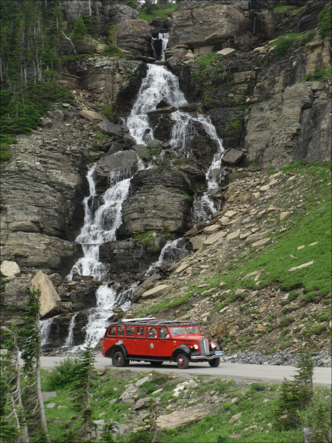 Glacier National Park-Views from west of Logans Pass on Going to the Sun Road.  Vintage GNP touring car
